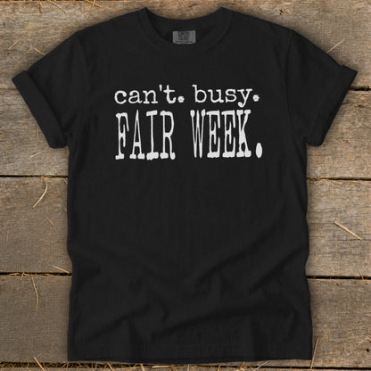 Black t-shirt with white text reading "can't. busy. FAIR WEEK."