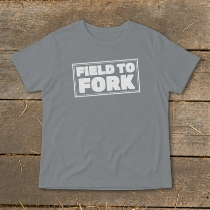 A gray short-sleeve t-shirt with a white stamped box graphic reading FIELD TO FORK.