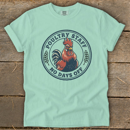 Light blue t-shirt with a circular graphic of a rooster and text "POULTRY STAFF NO DAYS OFF".