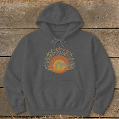Dark grey hoodie with a sunset and silhouette of a person with a horse.