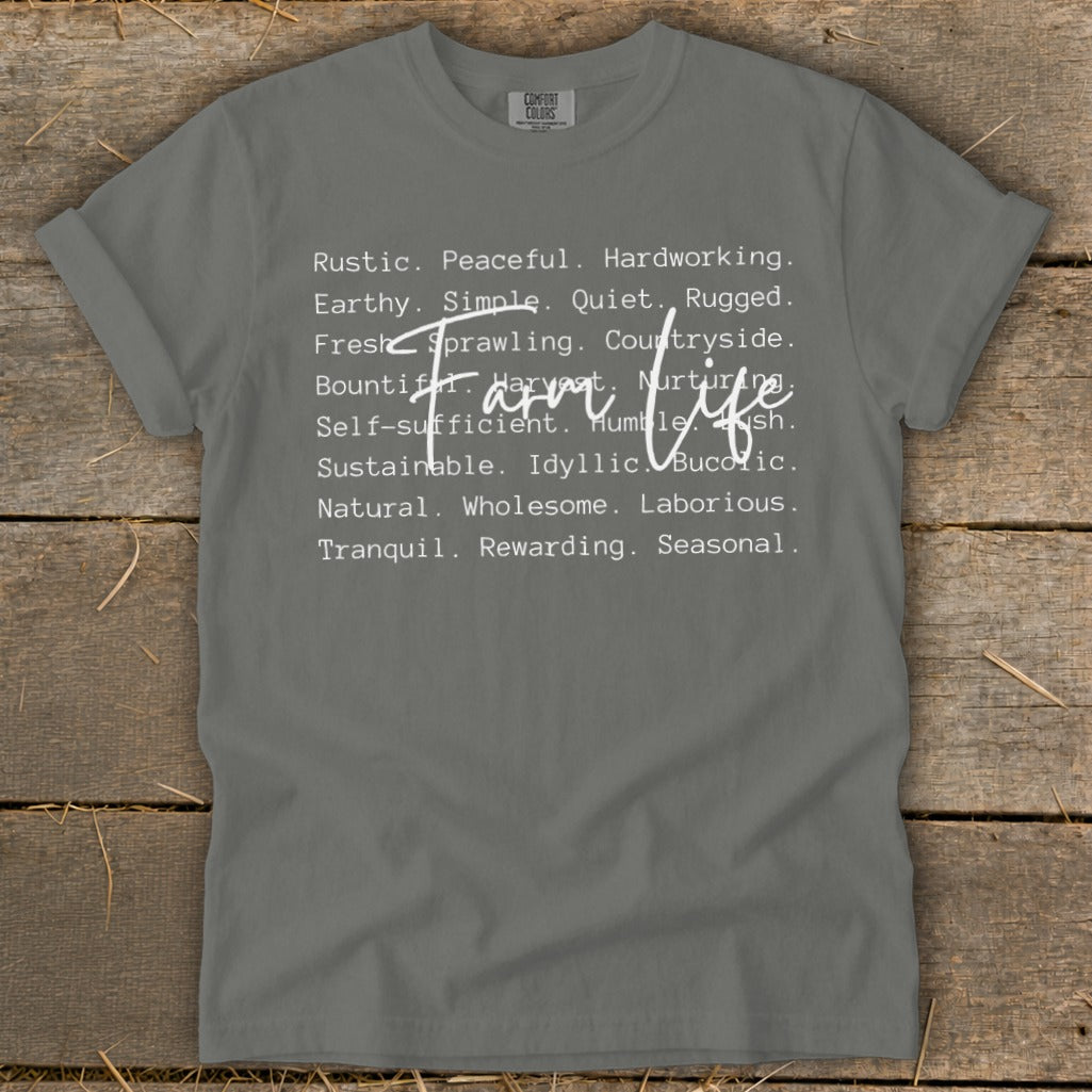 Grey t-shirt with white text "Farm life" and descriptive words.