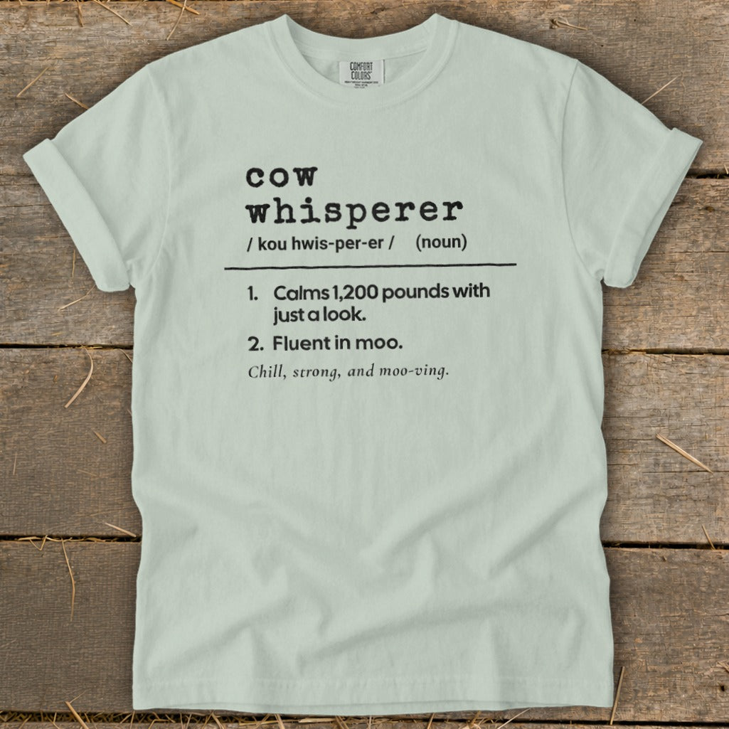 Light green t-shirt with "Cow Whisperer" definition text.