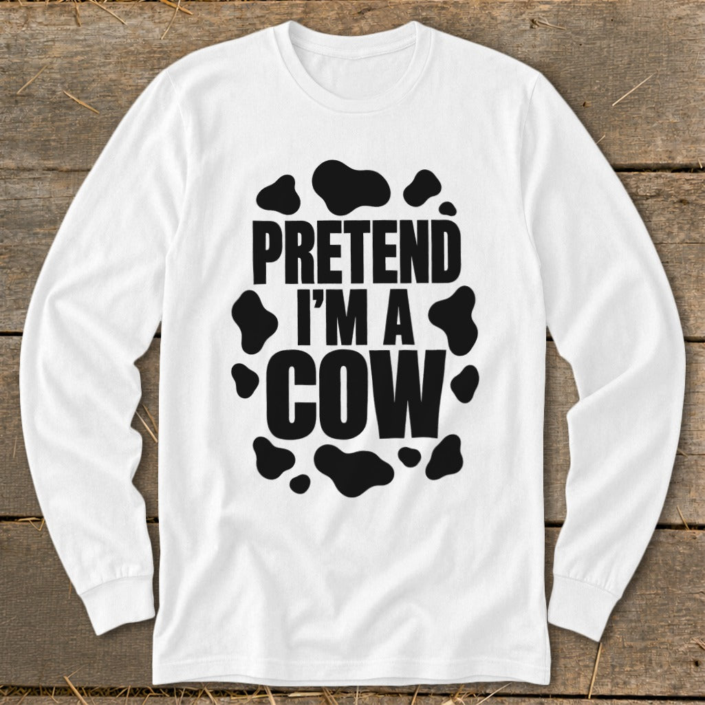White long-sleeve shirt with black "Pretend I'm a Cow" text and spots.