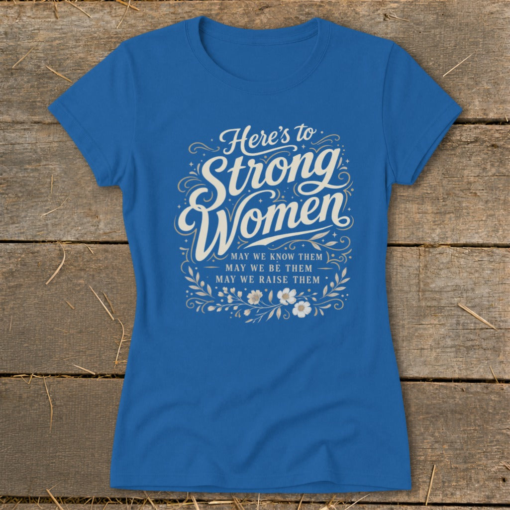 Blue t-shirt with "Here's to Strong Women" and floral accents.