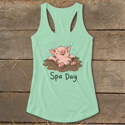 Mint green tank top with cartoon pig in mud bath, text "Spa Day".