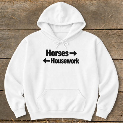 White hooded sweatshirt with black text reading Horses with a right arrow and Housework with a left arrow.