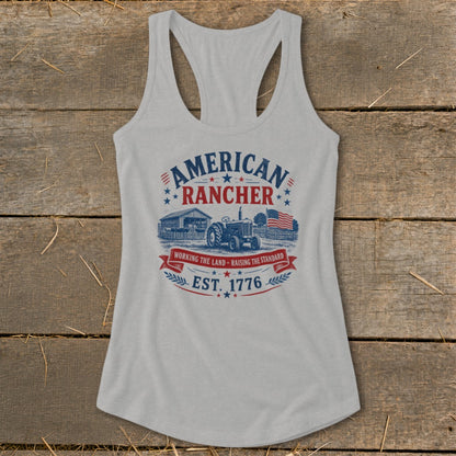 American Rancher graphic on a light grey tank top with tractor, barn, and flag.