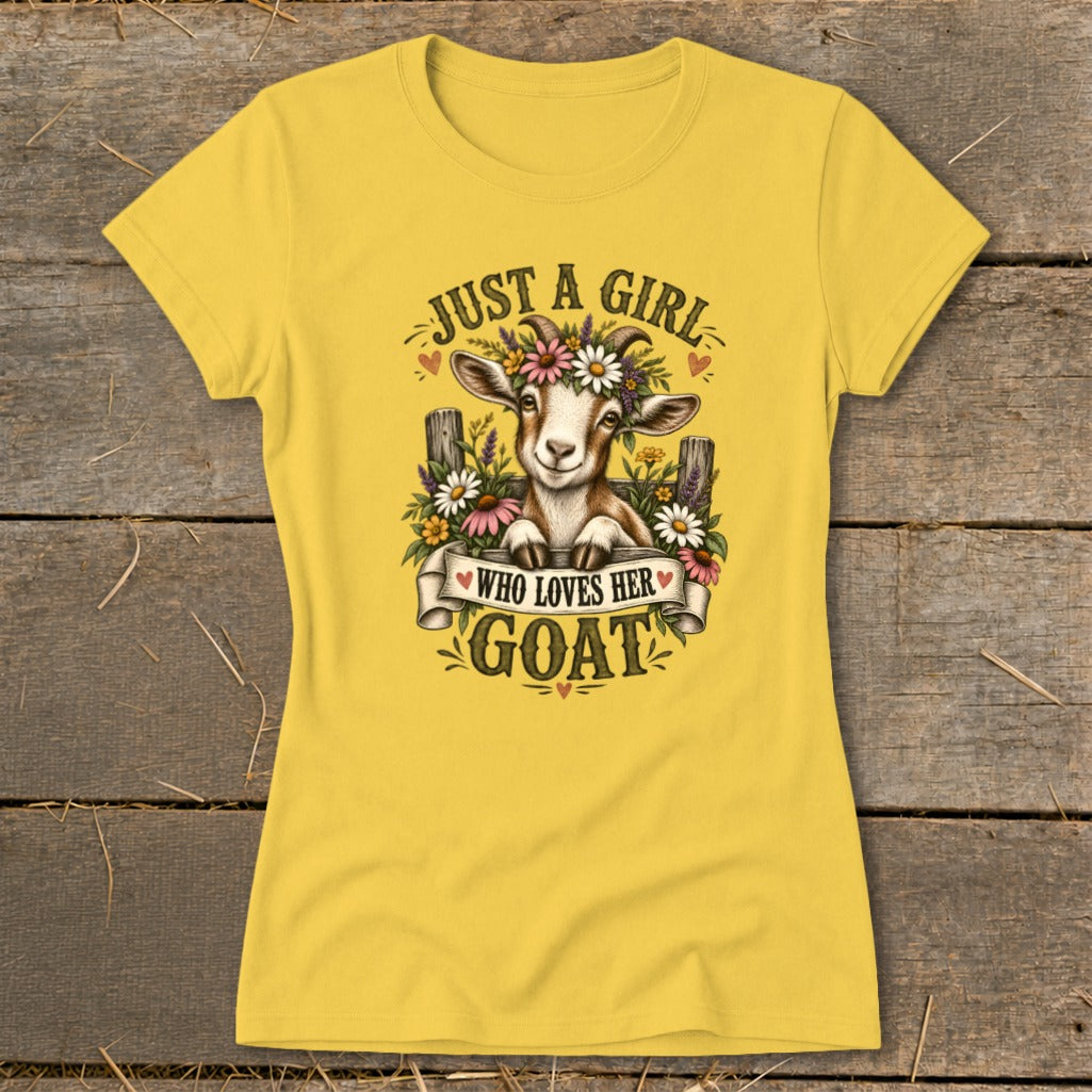 Yellow t-shirt with a graphic of a goat wearing a flower crown and text "Just a girl who loves her goat."