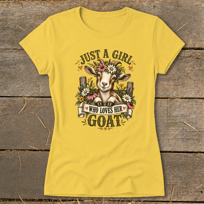 Yellow t-shirt with a graphic of a goat wearing a flower crown and text "Just a girl who loves her goat."