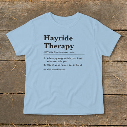 Light blue t-shirt with "Hayride Therapy" definition text and see also pumpkin patch.