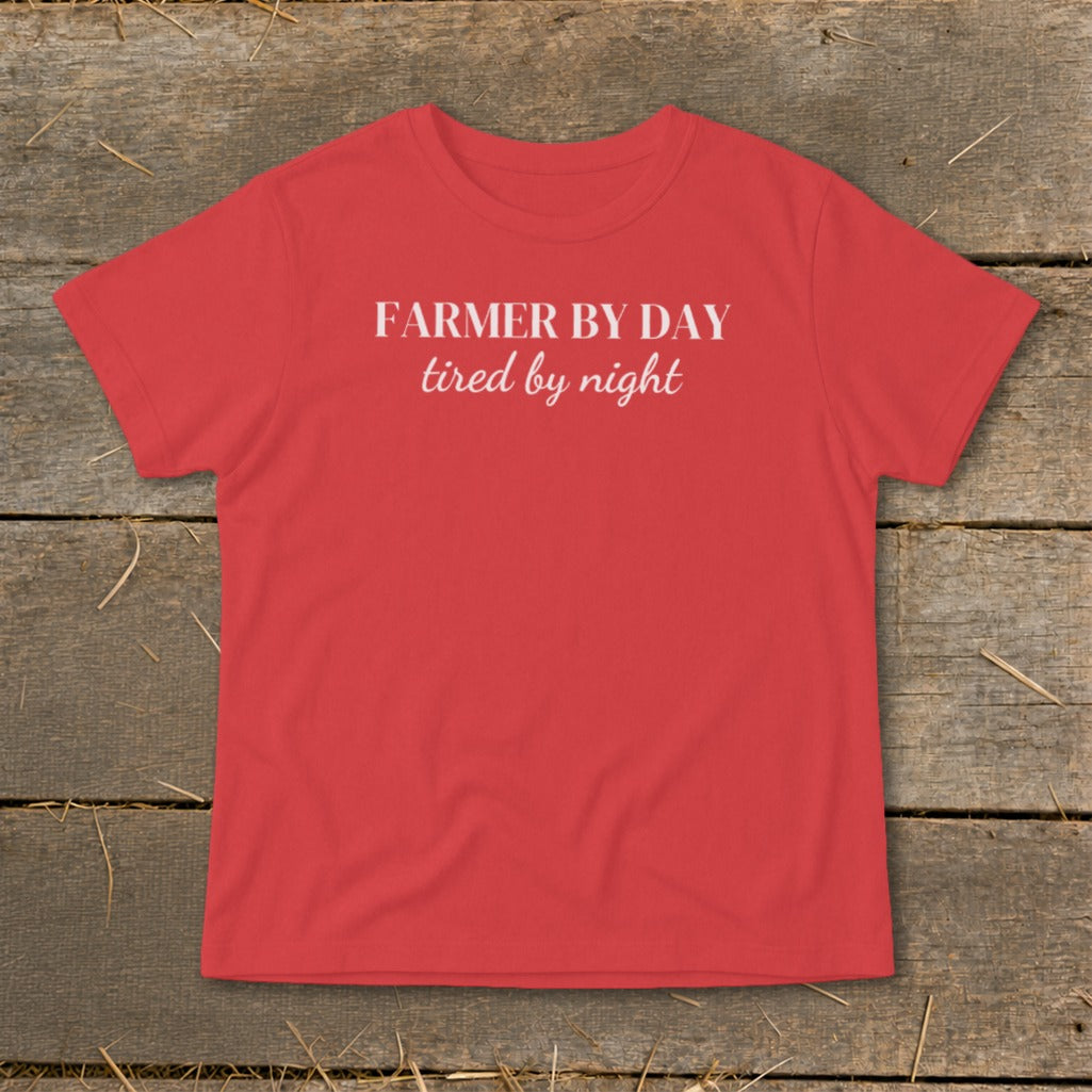 Red t-shirt with white text "FARMER BY DAY tired by night".