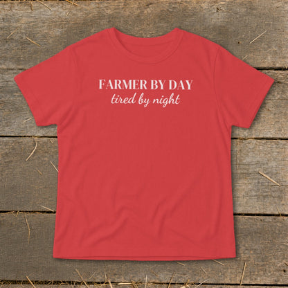 Red t-shirt with white text "FARMER BY DAY tired by night".