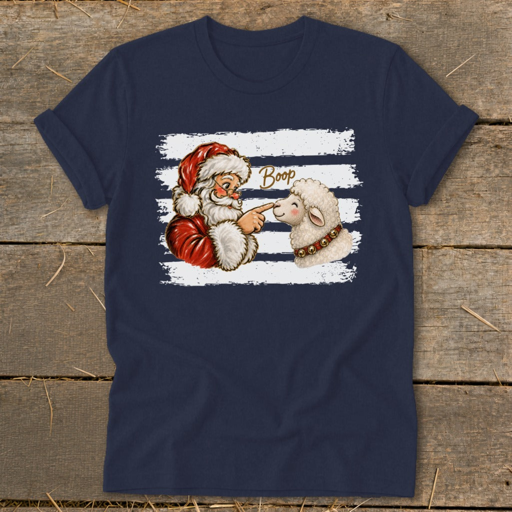 Santa boops a sheep's nose on a navy t-shirt with a striped background.