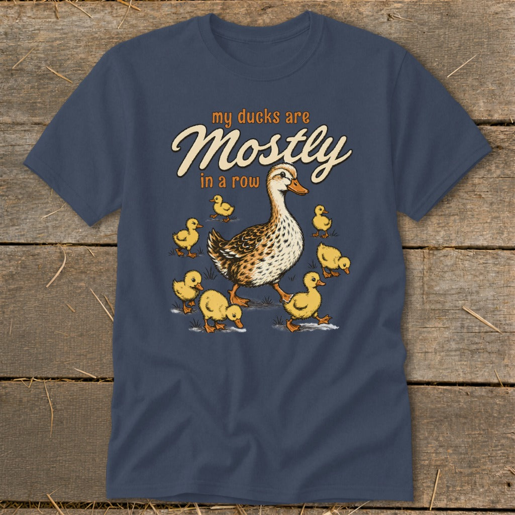 T-shirt graphic with a mother duck and ducklings and text "my ducks are Mostly in a row".