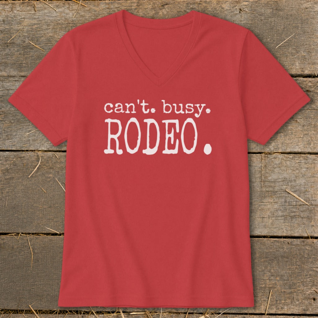 Red v-neck t-shirt with white text "can't. busy. RODEO."