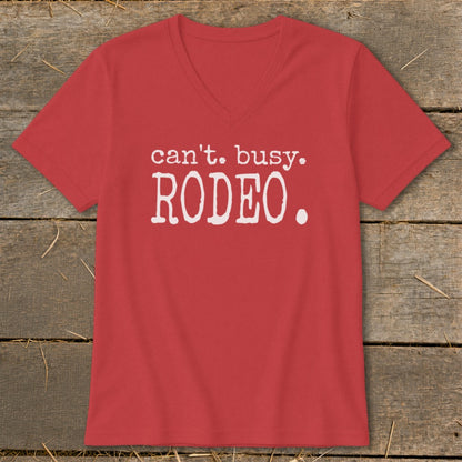 Red v-neck t-shirt with white text "can't. busy. RODEO."