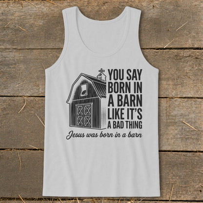 White tank top with barn graphic and text "You Say Born in a Barn Like It's A Bad Thing Jesus was born in a barn."