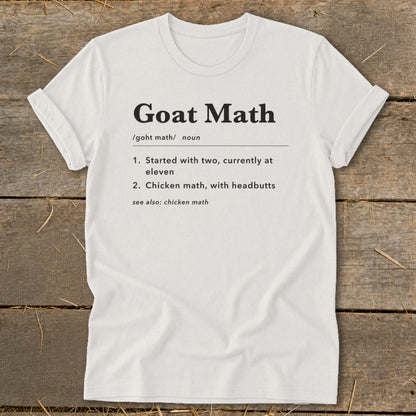 White t-shirt with "Goat Math" definition text including numbers and headbutts.