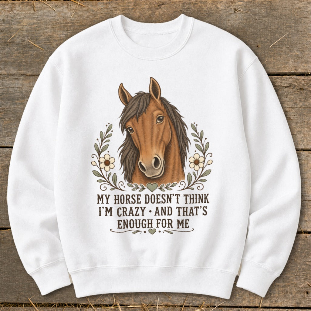White sweatshirt with horse graphic and text "My horse doesn't think I'm crazy and that's enough for me."