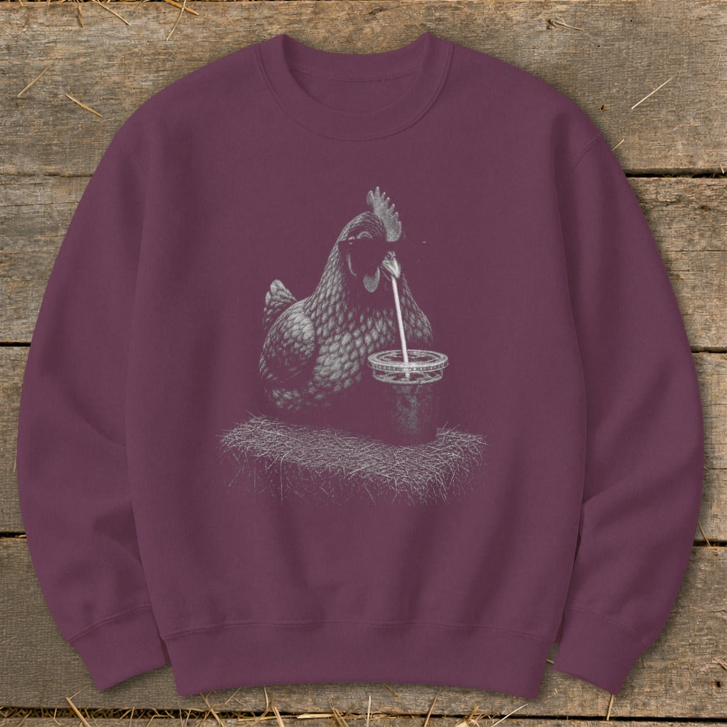 Chicken drinking from a cup with a straw, printed on a burgundy sweatshirt.