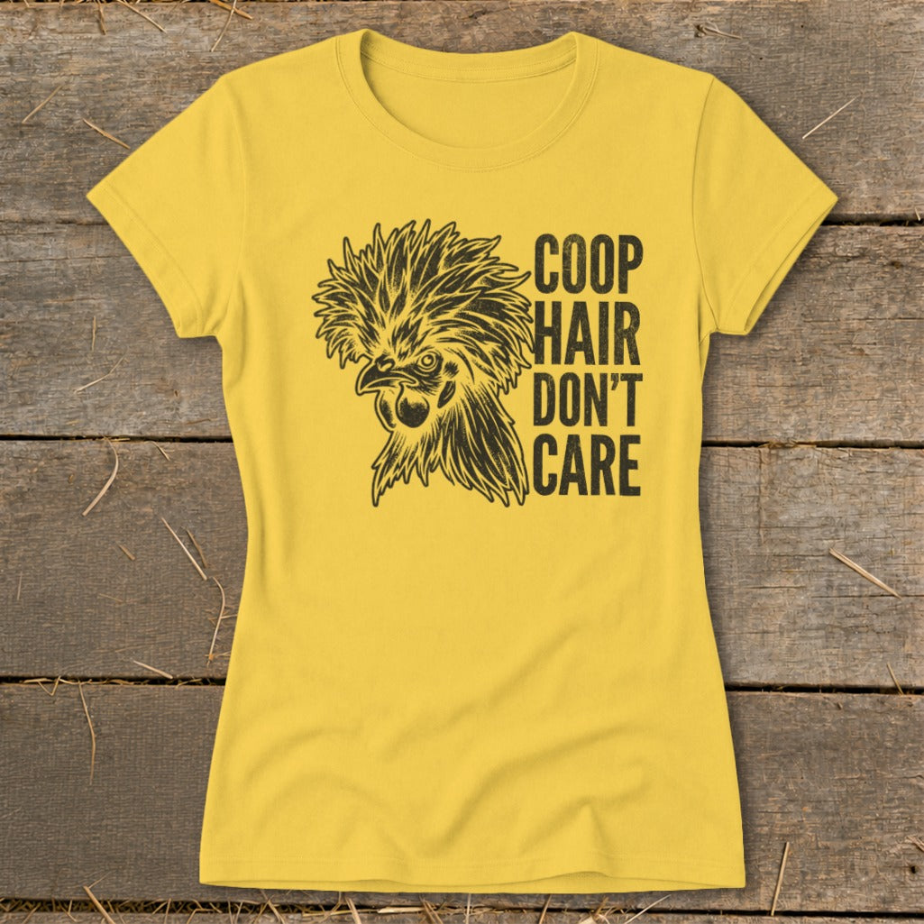 Yellow t-shirt with black graphic of a fluffy chicken and text: "COOP HAIR DON'T CARE".