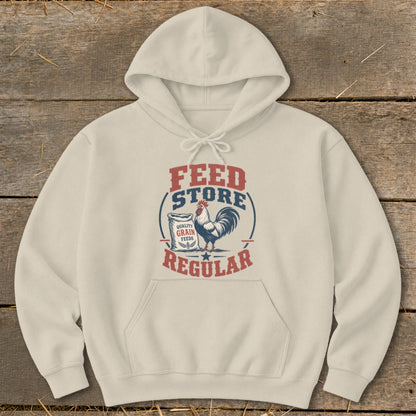 Light cream hoodie with "Feed Store Regular" text and a rooster graphic.