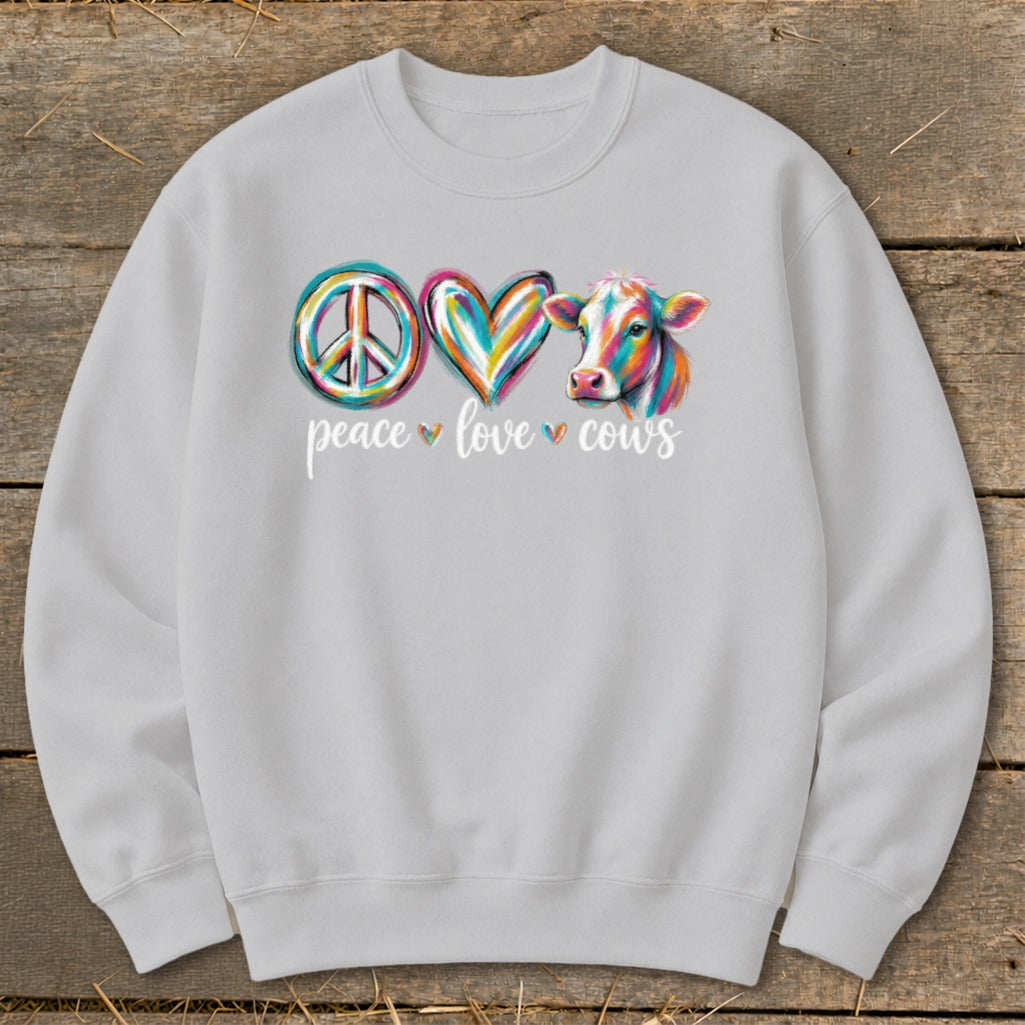 Light gray sweatshirt with a colorful peace sign, heart, and cow graphic and text.