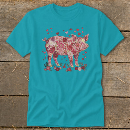 Teal t-shirt with a pink floral pig graphic and scattered red hearts.