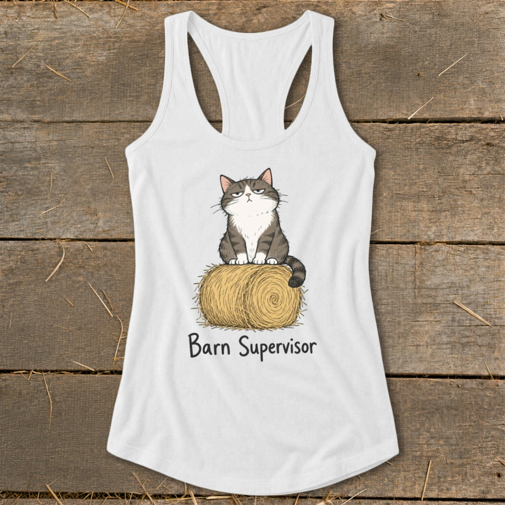 White tank top with a cartoon cat sitting on a hay bale, reading "Barn Supervisor".