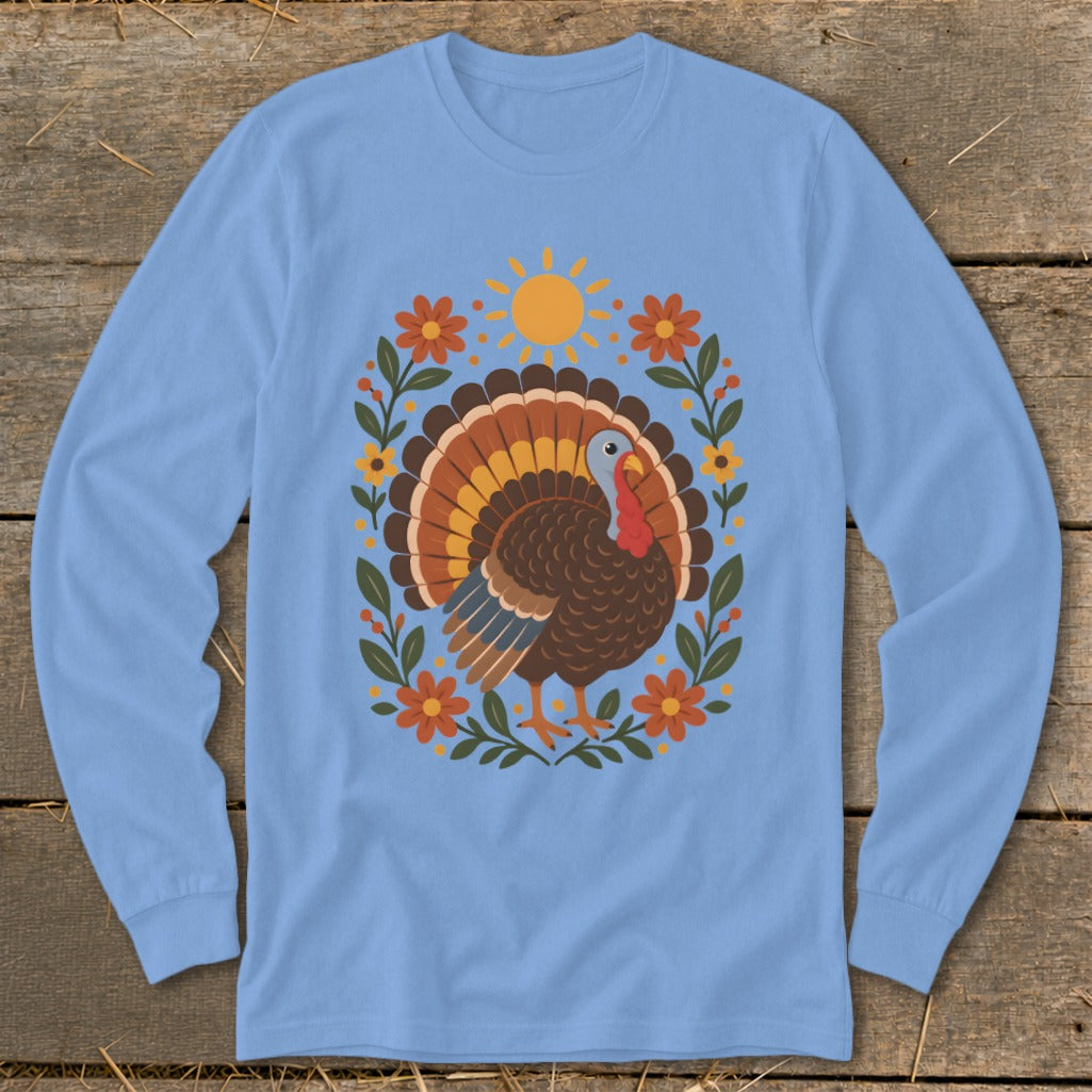 Light blue long-sleeve shirt with a graphic of a turkey surrounded by flowers and a sun.