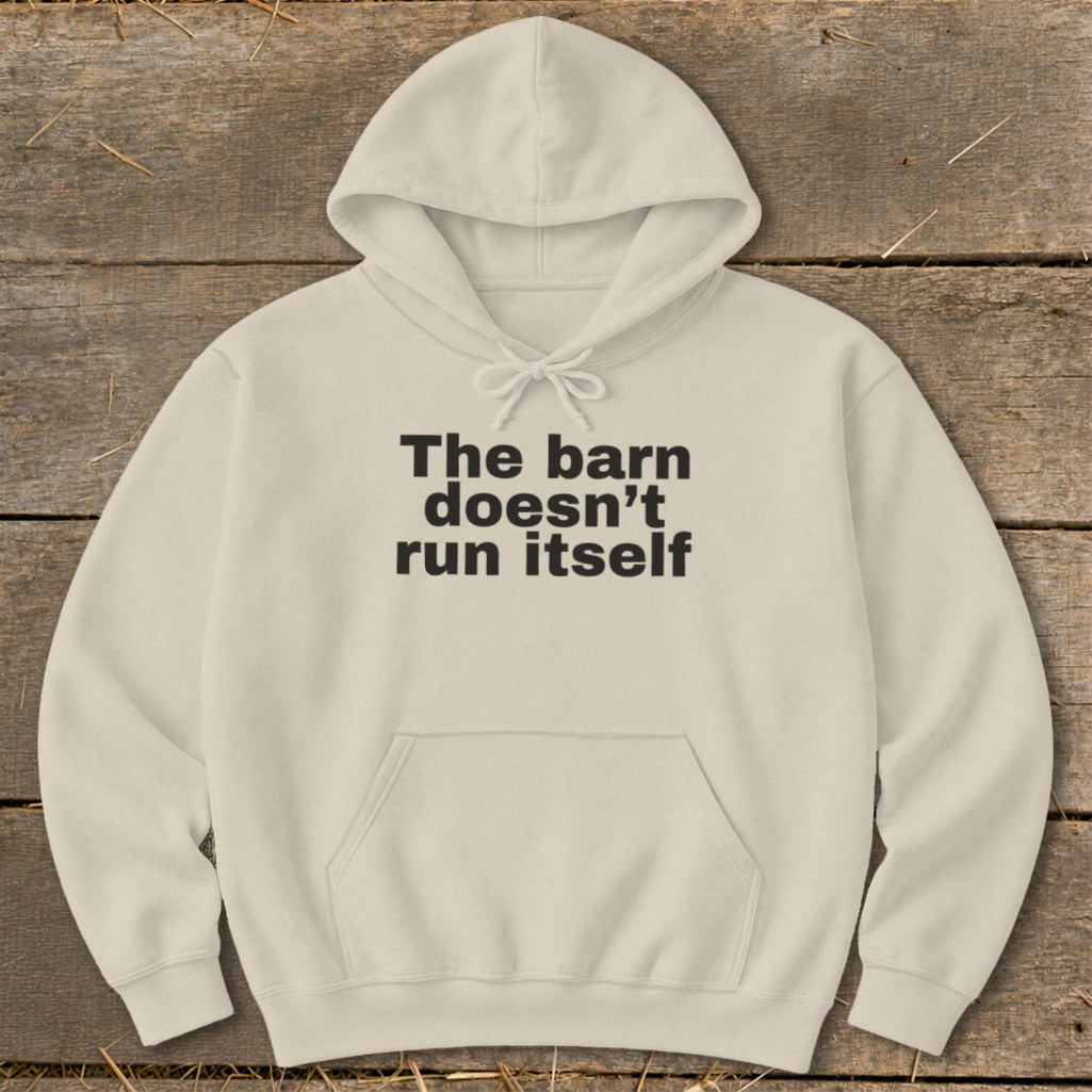 Cream hoodie with black text that reads "The barn doesn't run itself".