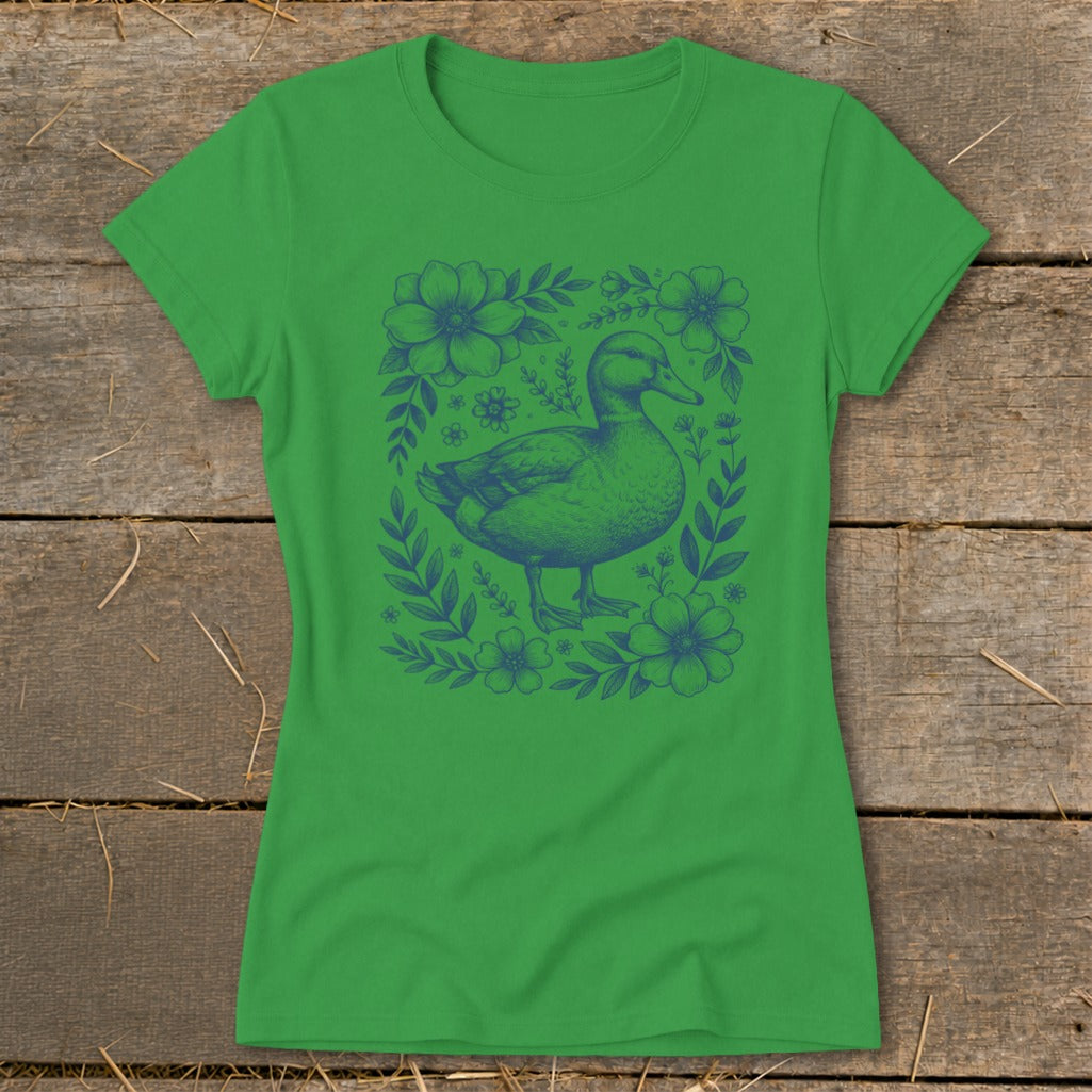 Green t-shirt with a blue duck and floral design in the center.