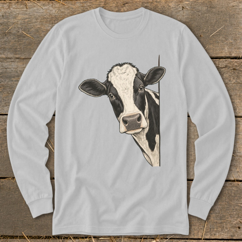 Black and white cow peeking from behind a corner on a light grey long-sleeve shirt.