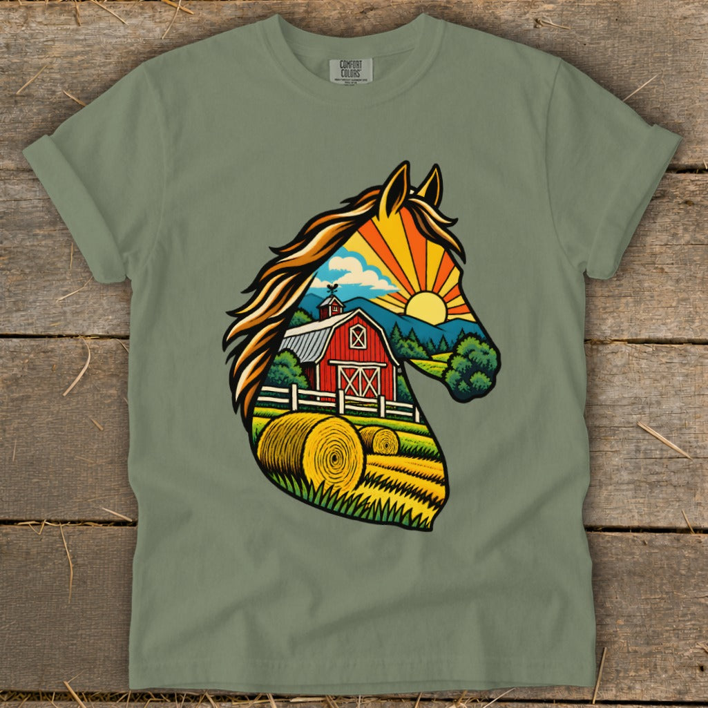 Sage green t-shirt featuring a graphic silhouette of a horse filled with a sunny farm scene.