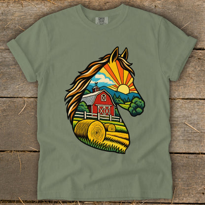 Sage green t-shirt featuring a graphic silhouette of a horse filled with a sunny farm scene.