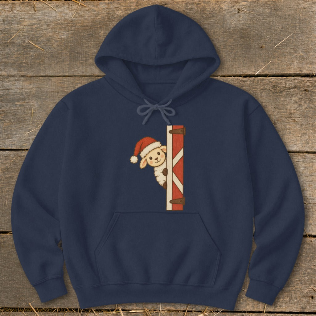 Navy hoodie with a graphic of a sheep wearing a Santa hat peeking around a barn door.