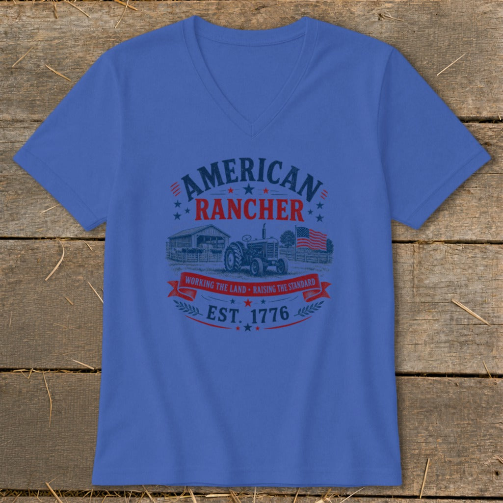 Blue t-shirt with American Rancher graphic, tractor, barn, and American flag.