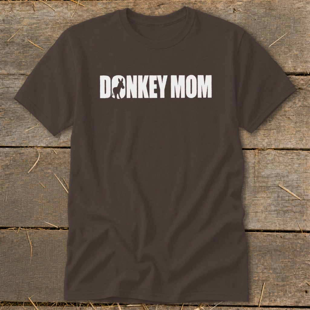 Brown crewneck t-shirt featuring the white text DONKEY MOM with a donkey silhouette inside the first letter O.