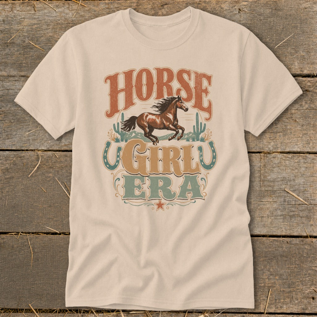 T-shirt with vintage western graphic of horse, cacti, and text "HORSE GIRL ERA".