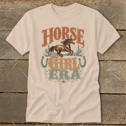 T-shirt with vintage western graphic of horse, cacti, and text "HORSE GIRL ERA".
