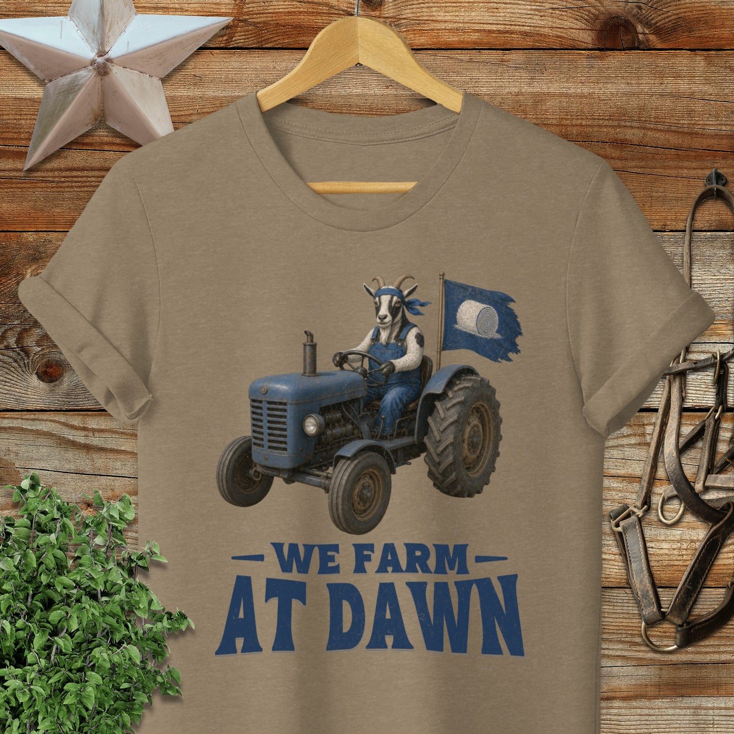 T-shirt with goat in tractor flying "We Farm At Dawn" flag.
