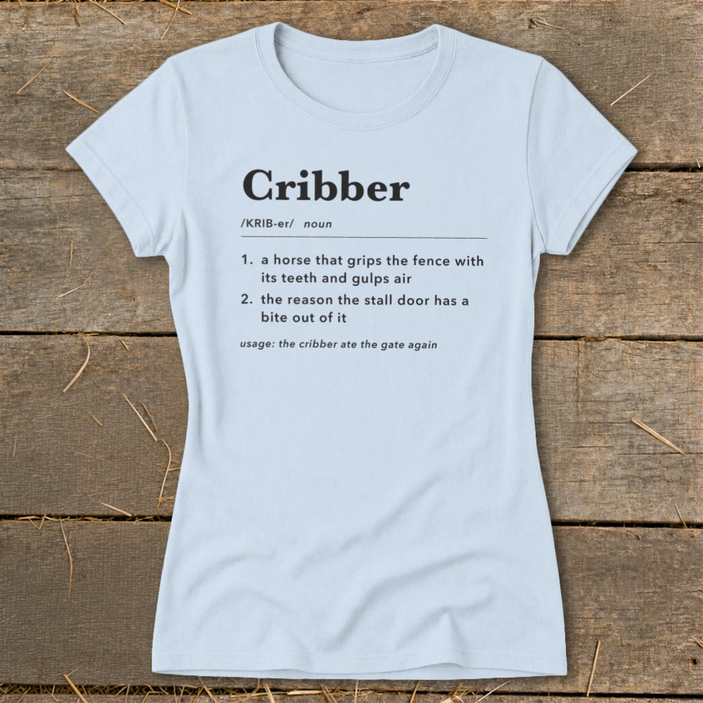 Light blue t-shirt featuring dictionary-style definitions for the word Cribber printed on the chest.