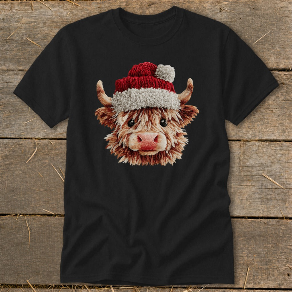 Black t-shirt with a fluffy highland cow wearing a Santa hat.