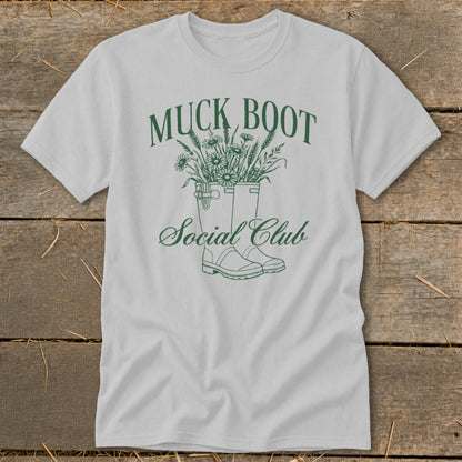 Muck Boot Social Club graphic on a light gray t-shirt.