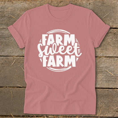 Pink t-shirt with white text that reads "Farm Sweet Farm" in a circular design.