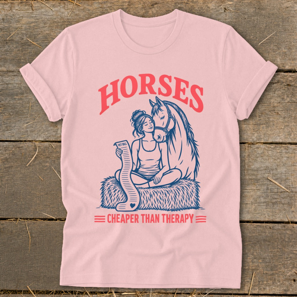 Pink t-shirt with graphic of woman and horse, text "Horses Cheaper Than Therapy"