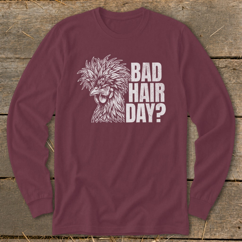 Maroon long sleeve shirt with a white graphic of a chicken and text that reads "BAD HAIR DAY?".