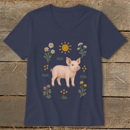 Navy t-shirt with a pink pig illustration surrounded by flowers and a sun.