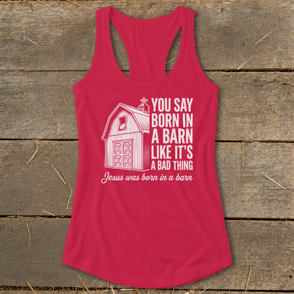 Red tank top with white barn graphic and text reading "Jesus was born in a barn".