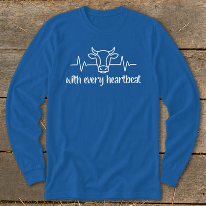 Blue long sleeve shirt with white cow and heartbeat graphic and text.
